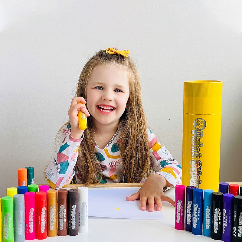 Young Girls creating Art with Paint Sticks Giant Stick