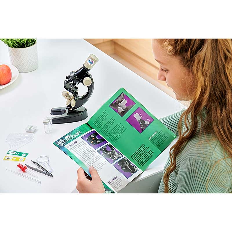 Science Mad 100x Microscope - Girl Reading Instruction Manual